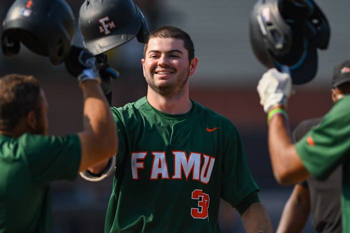 Florida A&M's Sebastian Greico celebrates with his teammates after hitting a three-run home run against Alabama State